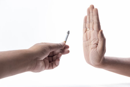 Person showing a hand sign to reject cigarette for quit smoking motivation.の写真素材