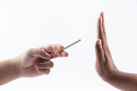 Hand reject or refuse sign for a cigarette from - quit smoking concept.の写真素材