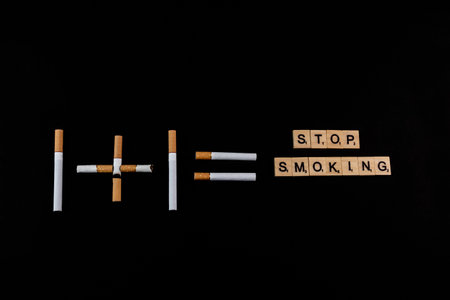 A new concept of stop smoking with cigarettes and wooden blocks.の写真素材