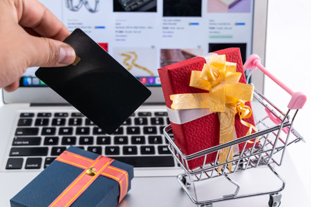 Beautiful gift for in shopping cart bought on the Internet - online shopping concept.