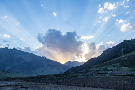 Beautiful sunset in the mountains with dark clouds.の写真素材