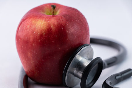 Stethoscope with apple concept for healthcare, nutrition or medical insurance.の写真素材