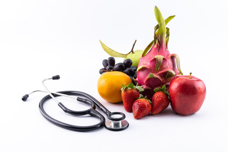 Healthy food in heart diet concept with stethoscope closeup.の写真素材
