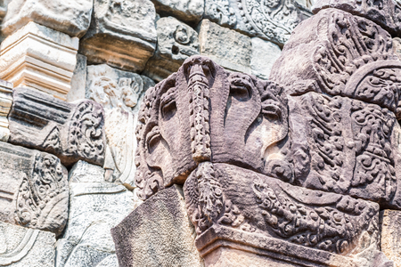 Antique architecture details from stones, part of the famous historic site in Thailand, called Prasat Sadok Kok Thom.の写真素材