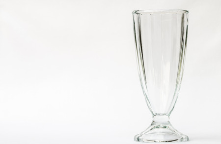 Empty tall glass on a white background.