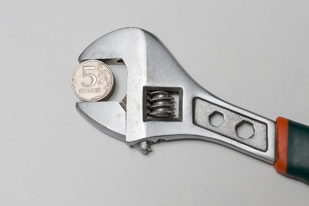 Wrench with jammed coin