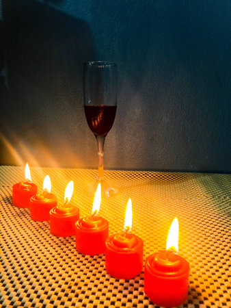 Romantic candles design art with red wine lifestyle photography Thailand.の素材