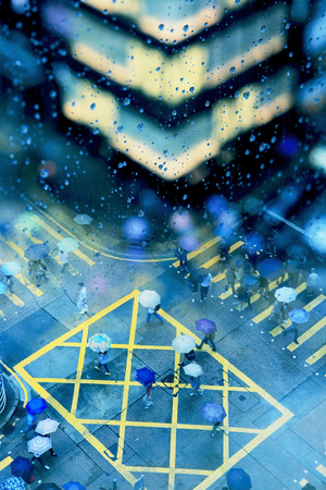 pedestrian crossroad in high angle view with raining effectのeditorial素材