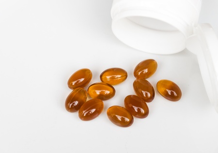 The fish oil capsules isolated on white background の写真素材