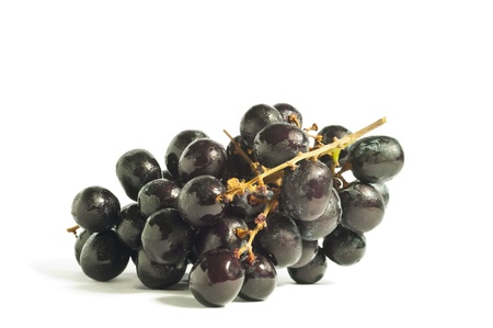 Black grape on the white backgroundの写真素材
