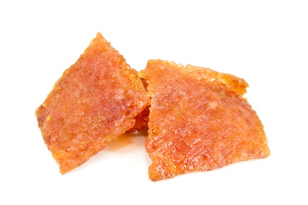 The sliced sheets of sweet dried pork (Bakkwa) isolated on white backgroundの写真素材