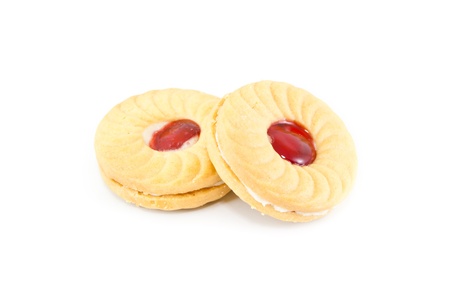 The biscuits with cream and strawberry jam isolatedの写真素材
