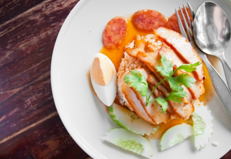 The dish of roasted pork with rice and eggの写真素材