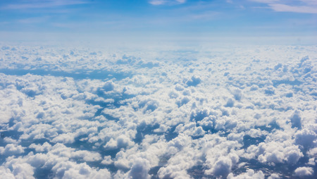 Blue sky, clouds and sun light backgroundの写真素材