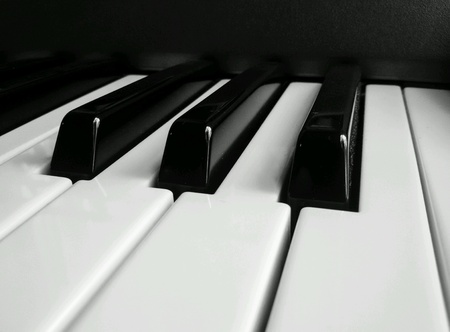 Close up of piano keys in black and whiteの素材