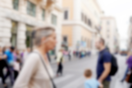 blur background of crowded people walk across the roadの写真素材