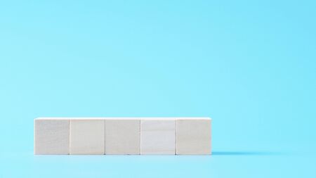 5 blank wood cube mock up in horizontal shape on isolated background for create letter or symbol, business, banner, advertising concept, banner size with copy spaceの写真素材