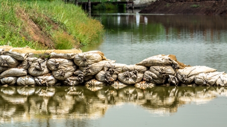 A wall of sandbags after used for protect  floodwaters.の写真素材