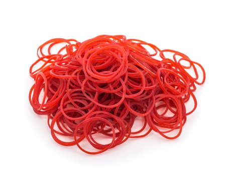 Red rubber band on white background の写真素材