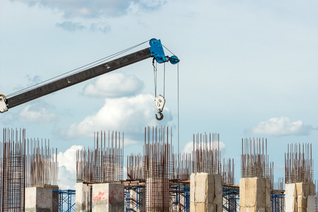 Construction site with cranes on sky background.の写真素材