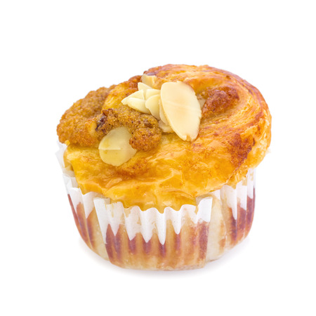 Banana nut muffin with large walnuts isolated on a white background.の写真素材