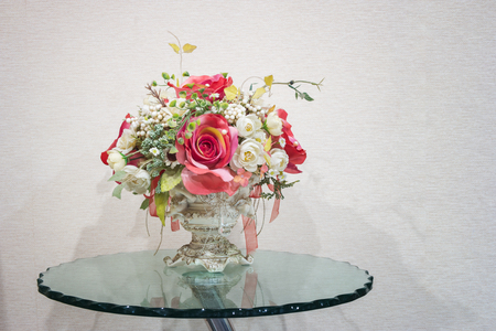 decoration flowers in jar on glass table.の写真素材