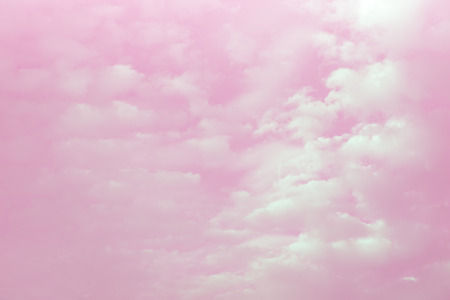 White fluffy clouds in the pink for valentine background design.の写真素材