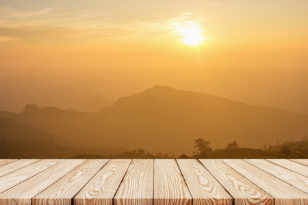 Wood shelf table with background of mountain view in the morning.の写真素材