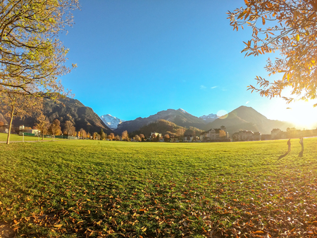 View of field and mountain background with beautiful sunset at Interlaken of Switzerland.の写真素材