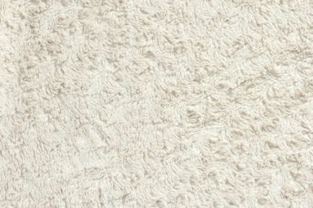 Texture of white fluffy fur. Luxurious wool texture close up for background.