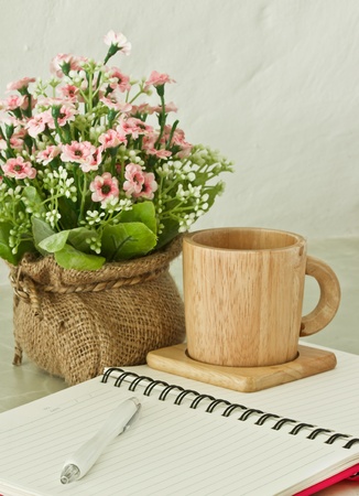 notebook with pen and cupの写真素材