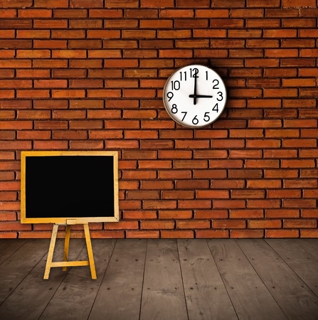 black board and clock on the wallの写真素材