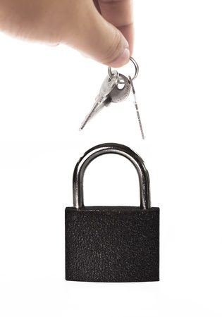 hand holding keys and lock over white