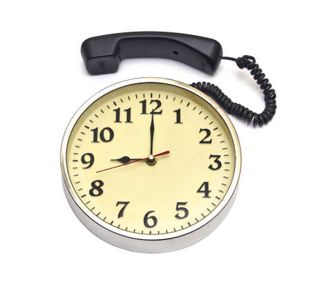calling time clock face and telephone over white の写真素材