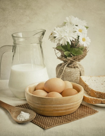 still life of eggs, milk and breadsの写真素材