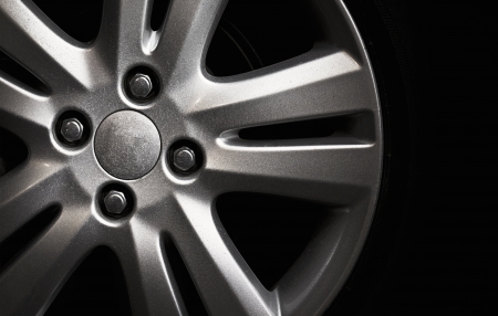 silver car wheel in the dark backgroundの写真素材