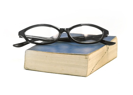book and eyeglass isolated on whiteの写真素材