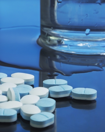 paracetamol and water in blue toneの写真素材