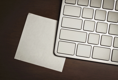 blank keyboard and notepad on tableの写真素材