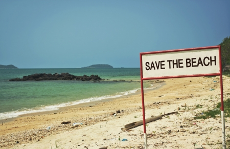 save the beach sign on the beachの写真素材