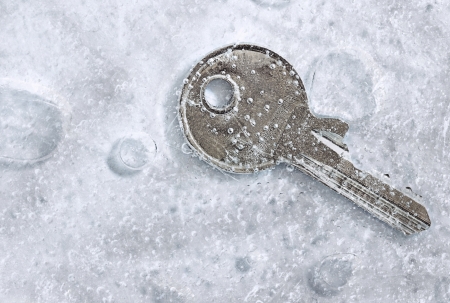 a frozen key in ice の写真素材
