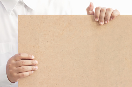 hand showing a blank brown boardの写真素材