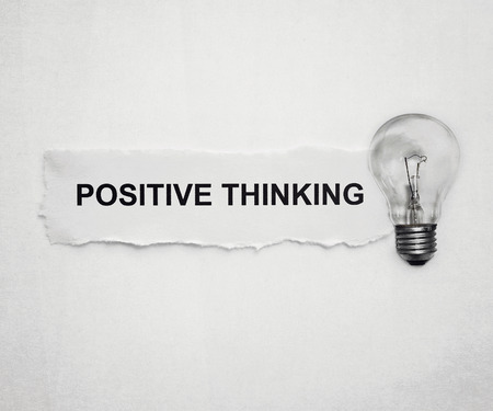 positive thinking : word on paper and light bulbの写真素材