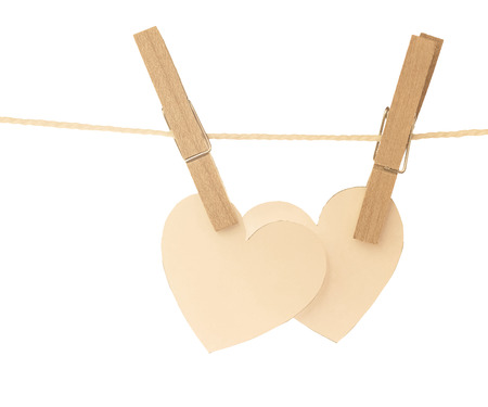 two hearts hanging on rope and white backgroundの写真素材