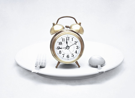 alarm clock on dish  vintage textured style 