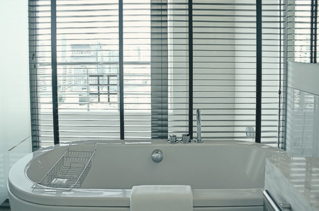 a bathtub with city viewの写真素材