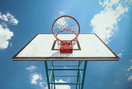 under the basketball ring and blue sky backgroundの写真素材
