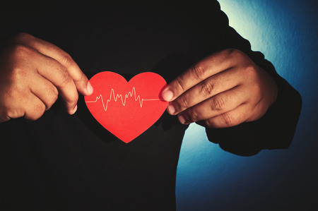 hands holding heart symbol in vintage style