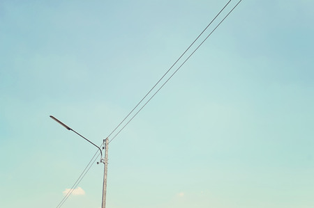 lamp on electricity post and sky backgroundの写真素材