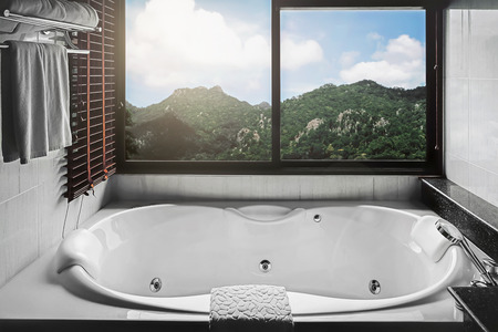 bathtub bath tub with mountain viewの写真素材